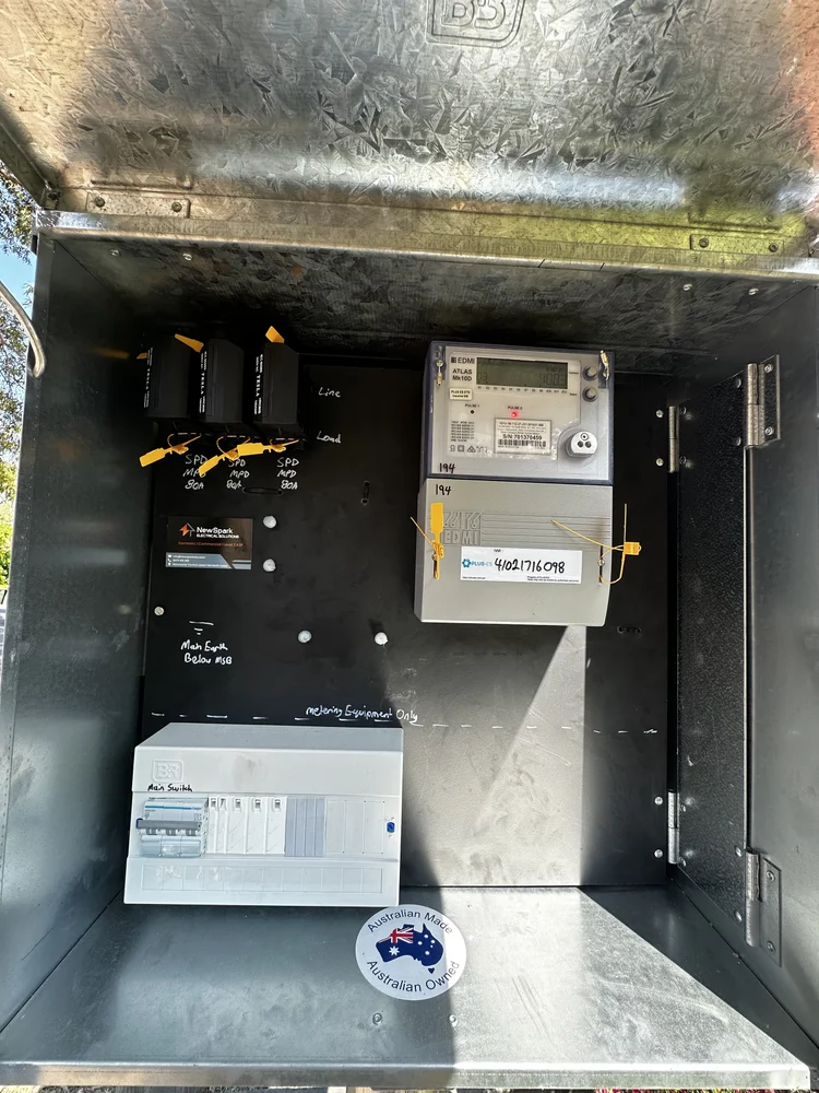 Inside an electrical meter box showing meter and circuits
