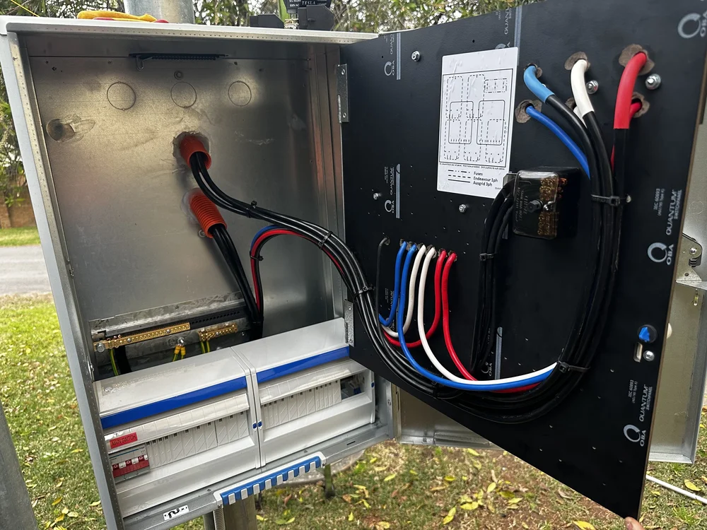 Open outdoor electrical cabinet with organised cabling