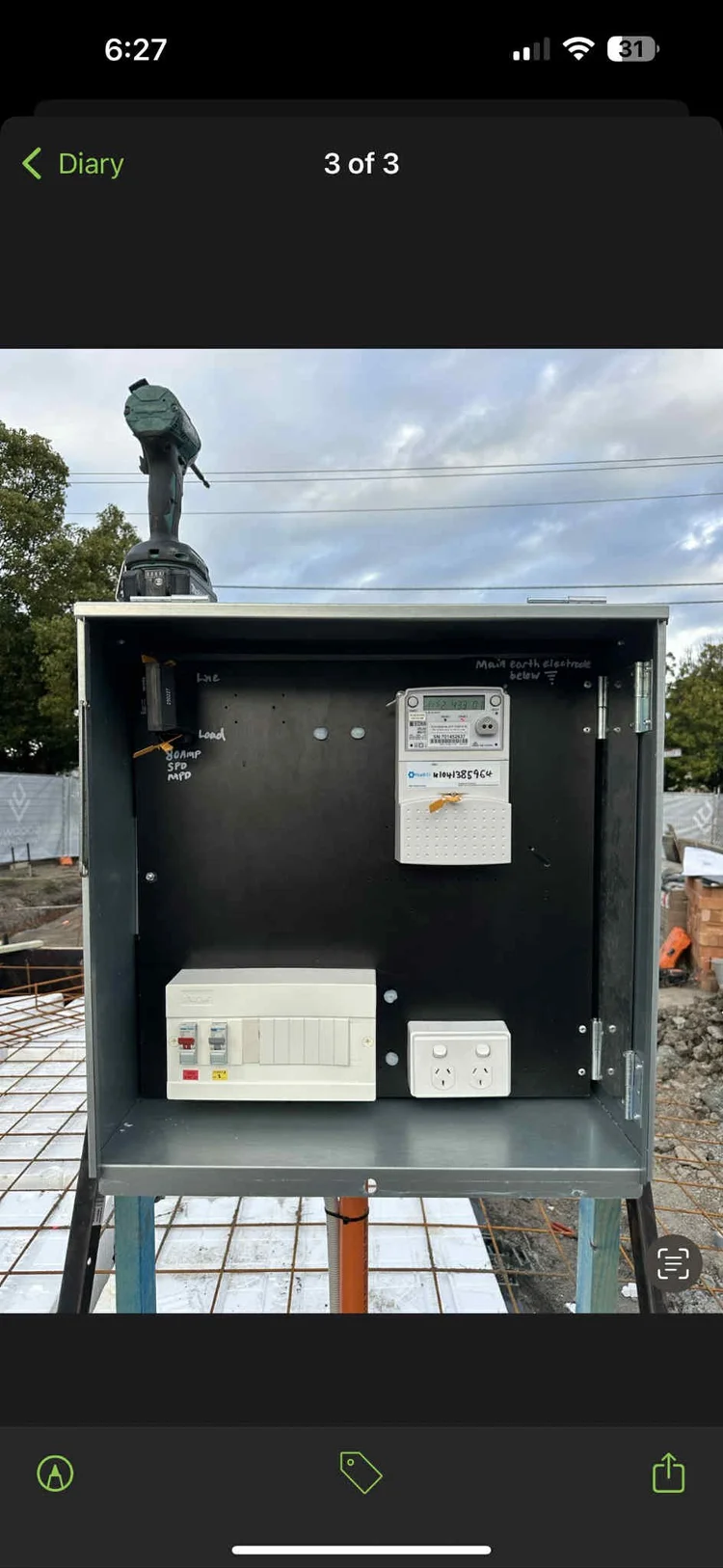 Open electrical service box with wiring and components